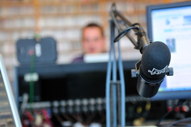 Two people in an interview setting with a recorder